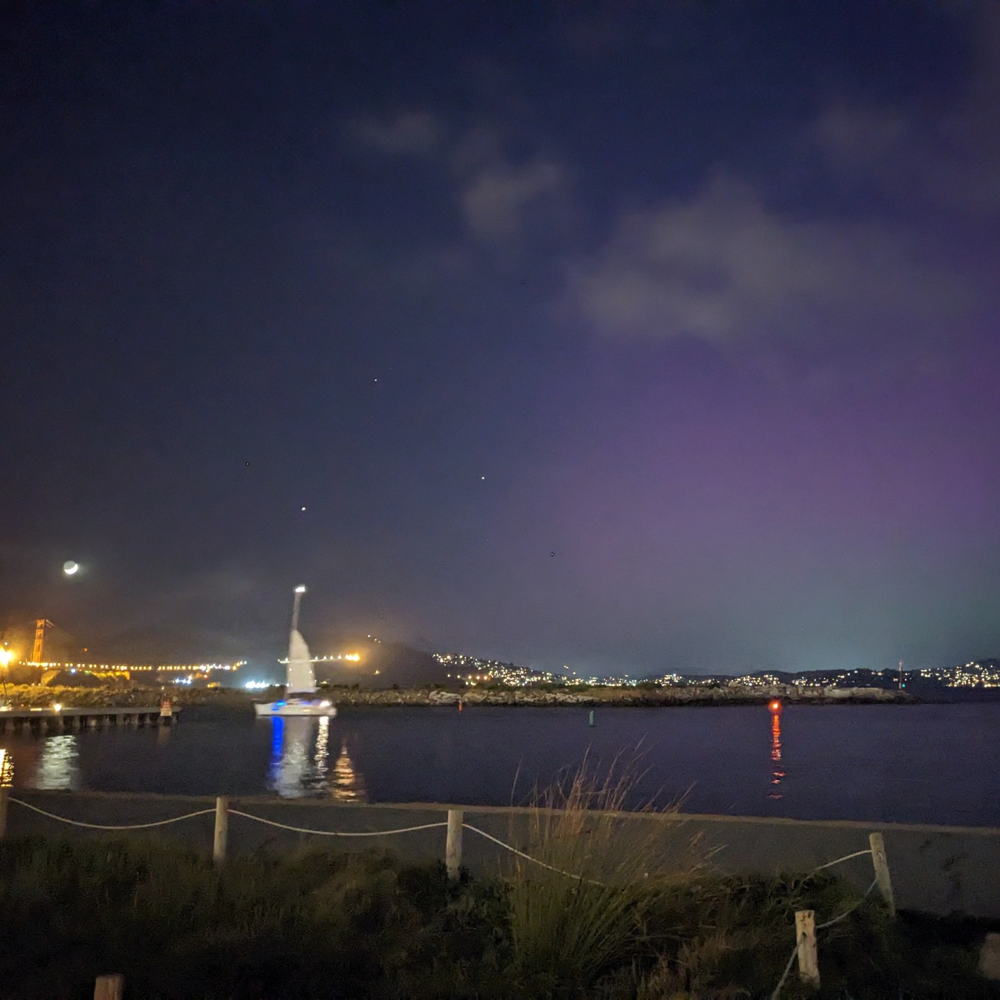 Rarely seen together: The Golden Gate Bridge and the northern lights. Taken this evening from the Marina Green, San Francisco.